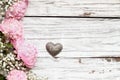 Pink Peonies Babys Breath Flowers and Heart over a Rustic White Wood Background Royalty Free Stock Photo