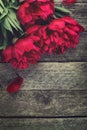 Pink peonies flowers on rustic wooden background. Selective focus Royalty Free Stock Photo