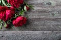 Pink peonies flowers on rustic wooden background. Selective focus Royalty Free Stock Photo