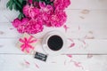 Pink peony flowers,gift box , cup of coffee and notes good morning on white rustic table from above, breakfast on Mothers day or W Royalty Free Stock Photo