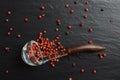 Pink pepper in a glass spoon Royalty Free Stock Photo