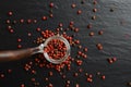 Pink pepper in a glass spoon Royalty Free Stock Photo