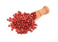 Pink pepper, Red peppercorns in a wooden spoon Royalty Free Stock Photo
