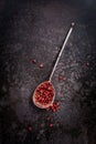 Pink pepper in a spoon Royalty Free Stock Photo