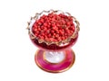 Pink pepper on wintage glass bowl. isolated Royalty Free Stock Photo