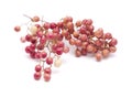 pink peppercorn clusters isolated on white
