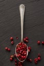 Pink peppercorn on a spoon Royalty Free Stock Photo