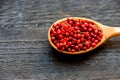 Pink peppercorn in wooden spoon studio shot Royalty Free Stock Photo