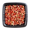 Pink peppercorns Baie rose in bowl isolated Royalty Free Stock Photo