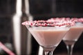 Pink peppermint martini with candy cane rim Royalty Free Stock Photo