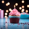 Pink perfection Birthday cupcake with burning candle on blue background Royalty Free Stock Photo