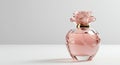 Pink Perfume Bottle with Rose Detail on White Background Royalty Free Stock Photo