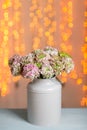 Pink persian buttercup flowers. Curly peony ranunculus in Metallic gray vintage can. Vase with beautiful bouquet on Royalty Free Stock Photo