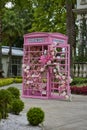 Pink phone booth with flowers, sweet 16 event decoration for quinceaÃÂ±era