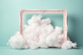 Pink photo frame with clouds inside on light turquoise background. Retro border elegant element