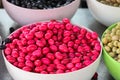 Pink pickled olives in white bowls at the oriental bazaar, Alanya, Turkey, April 2021 Royalty Free Stock Photo