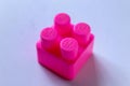 pink piece of block. Top angle view of lego brick on white background Royalty Free Stock Photo