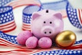 Pink pig bank accented by gold egg, pink eggs and American colors