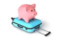 Pink piggy bank on a blue suitcase. Budget tourism. isolated on white background. 3d render Royalty Free Stock Photo