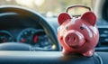 Pink piggy bank in the car interior. The concept of purchasing, credit, leasing or car insurance