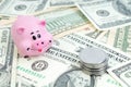 Pink piggy bank, dollars on a white background. savings concept, fundraising. coins Royalty Free Stock Photo