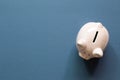 Pink piggy bank isolated on navy blue background Royalty Free Stock Photo