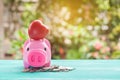 pink piggy bank over coins stack, saving money Royalty Free Stock Photo