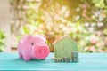 Pink piggy bank over coins stack, saving money Royalty Free Stock Photo