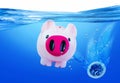 Pink Piggy Bank Sinking. Royalty Free Stock Photo