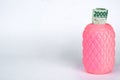 a pink piggy bank with twenty thousand rupiah n white background