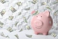 Pink piggy bank on table. Money saving Royalty Free Stock Photo