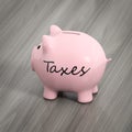 a pink piggy bank with the word taxes Royalty Free Stock Photo