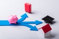 Pink Piggybank On Blue Arrows Showing Various Choices Royalty Free Stock Photo