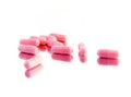 Pink pills on a mirror Royalty Free Stock Photo