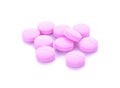 Pink pills over white macro shot