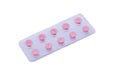 Pink pills in a package isolated on a white background Royalty Free Stock Photo