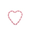 Pink pills in the shape of a heart on a white isolated background. One-to-one square shot for social networks. Heart Royalty Free Stock Photo