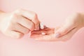 Pink pills tablets in the woman hand on pink background. Top view. Flat lay. Copy space. Medicine concept Royalty Free Stock Photo