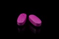 Pink pills vitamins Royalty Free Stock Photo