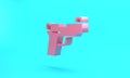 Pink Pistol or gun icon isolated on turquoise blue background. Police or military handgun. Small firearm. Minimalism