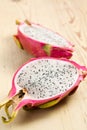 Pink pitahaya on wooden table