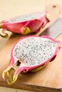 Pink pitahaya on wooden table
