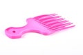 Pink plastic afro comb.