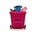 Pink plastic container with textile waste, dirty and ragged clothes. Garbage bin with two wheels. Flat vector design