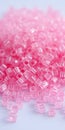 Pink plastic cylinder beads arranging a shiny pile Royalty Free Stock Photo
