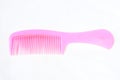 Pink plastic hair comb isolated on white background Royalty Free Stock Photo