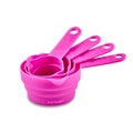 Pink plastic measuring spoons isolated on white background, copy space. Royalty Free Stock Photo
