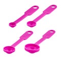 Pink plastic measuring spoons isolated on white background, copy space. Royalty Free Stock Photo