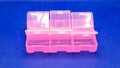 Pink plastic organizer with cells blue