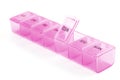 Pink plastic organizer, for pills isolated on white background. Close-up on compartments pill case with clip lids medicine. Daily Royalty Free Stock Photo